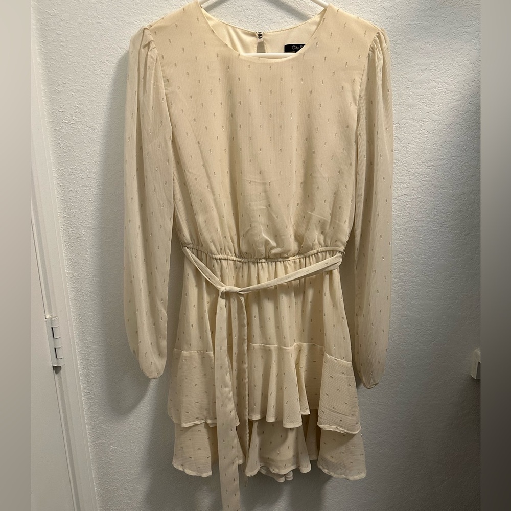 Long sleeve dress in cream with gold detail.